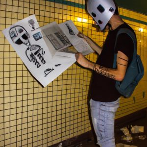 Person creating underground comic art